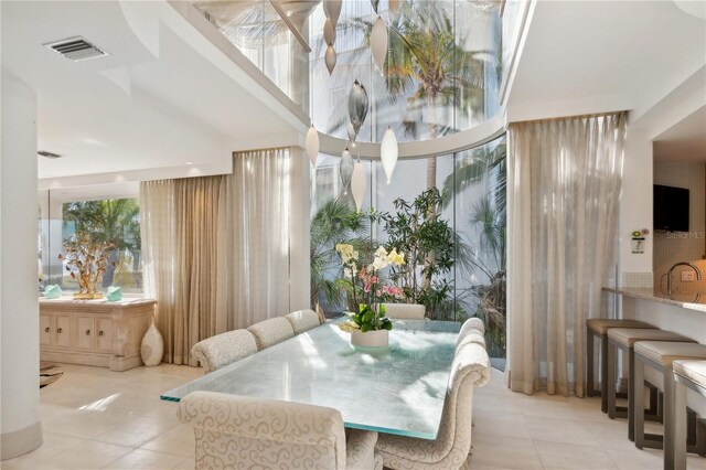 648 Beach Rd, Sarasota, FL 34242 - dining area featuring tile patterned floors