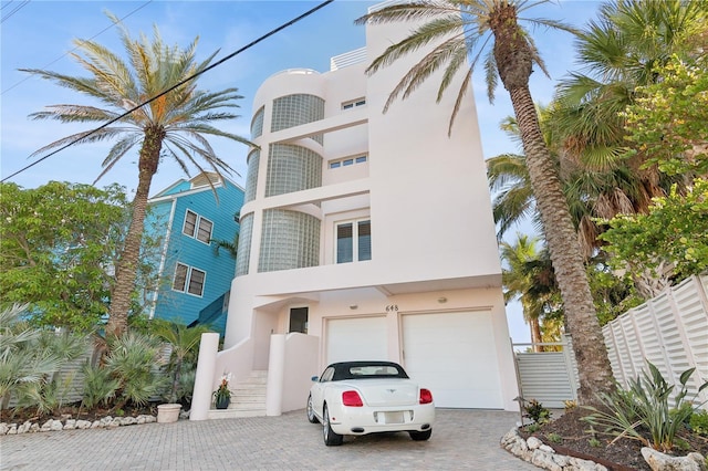 648 Beach Rd, Sarasota, FL 34242 - view of property with a garage and decorative driveway