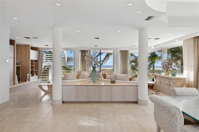 648 Beach Rd, Sarasota, FL 34242 - living area featuring recessed lighting, light tile patterned flooring, and stairs