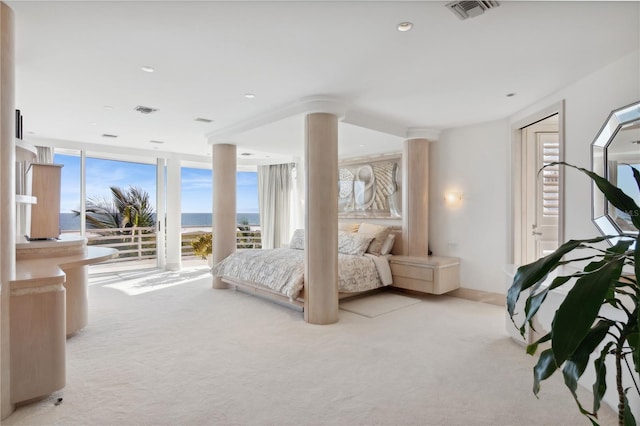 648 Beach Rd, Sarasota, FL 34242 - bedroom featuring light colored carpet, access to outside, recessed lighting, and expansive windows