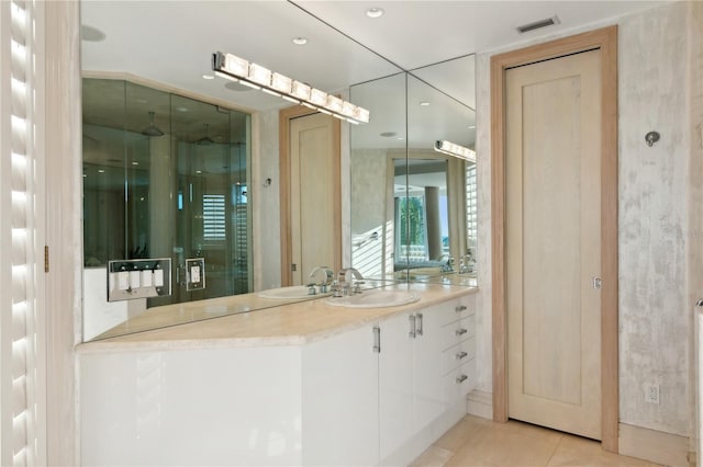 648 Beach Rd, Sarasota, FL 34242 - full bathroom featuring vanity, a stall shower, tile patterned flooring, and recessed lighting