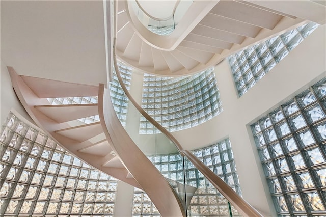 648 Beach Rd, Sarasota, FL 34242 - staircase with a high ceiling