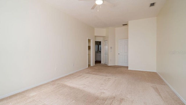 carpeted empty room with ceiling fan