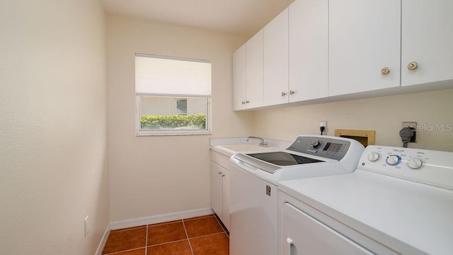 washroom featuring cabinets, sink, independent washer and dryer, and dark tile patterned floors