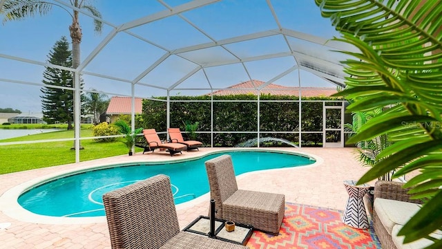 view of pool with a lanai and a patio area