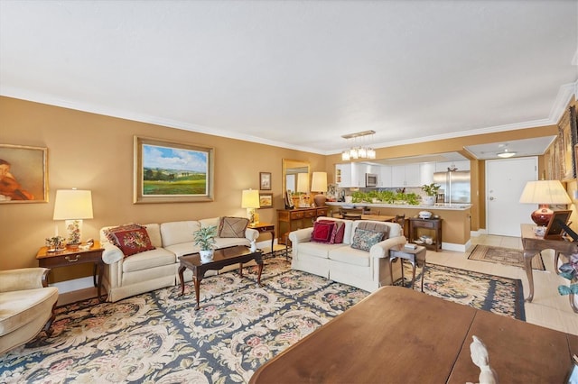 living area featuring light tile patterned floors, baseboards, ornamental molding, and a notable chandelier