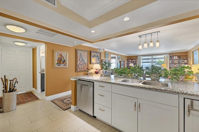 kitchen with dishwasher, ornamental molding, a sink, and white cabinetry