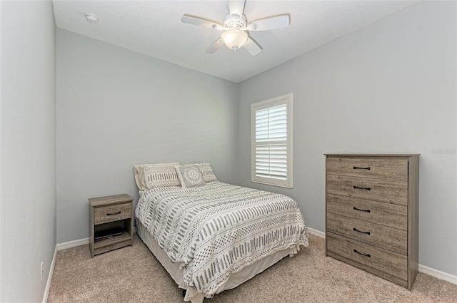 bedroom with light carpet and ceiling fan