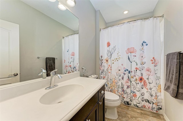 bathroom featuring vanity, toilet, a shower with curtain, and wood-type flooring