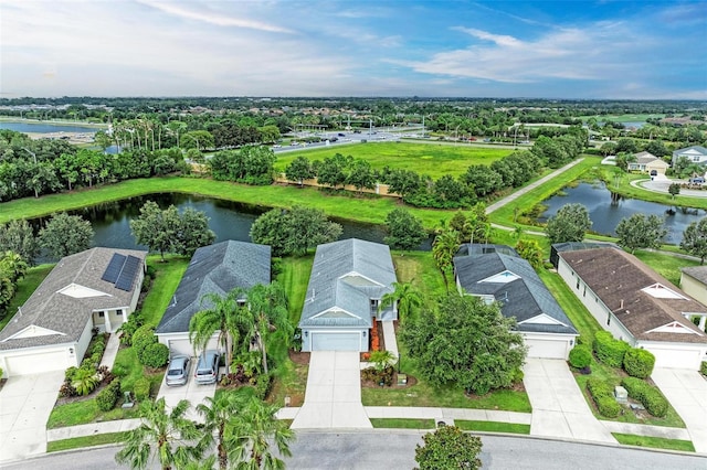 aerial view with a residential view and a water view