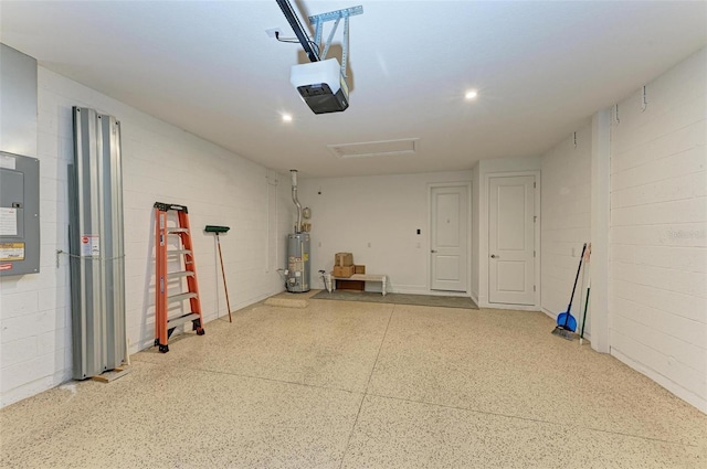 garage with a garage door opener, gas water heater, and electric panel