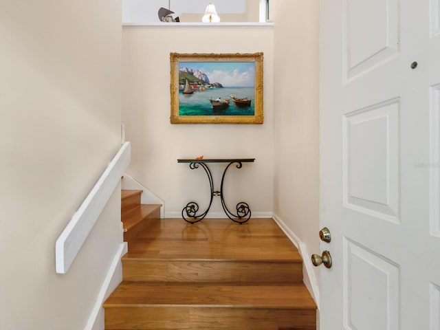 staircase featuring hardwood / wood-style floors