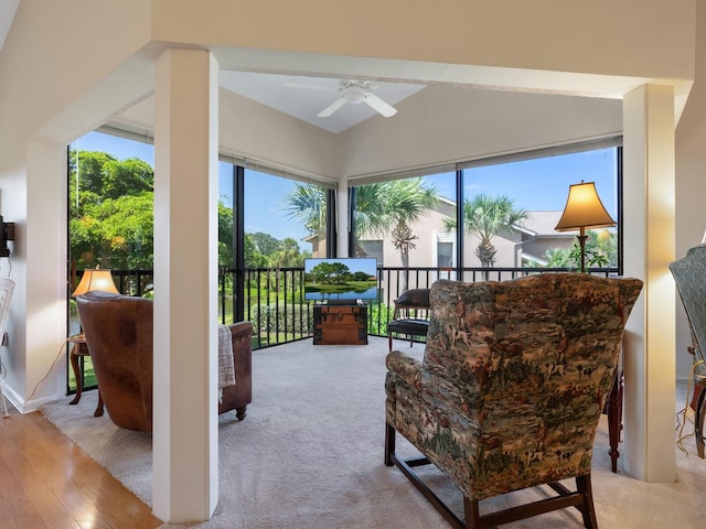 sunroom / solarium featuring ceiling fan and vaulted ceiling