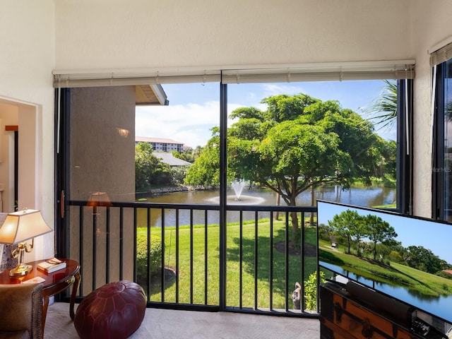 sunroom with a water view