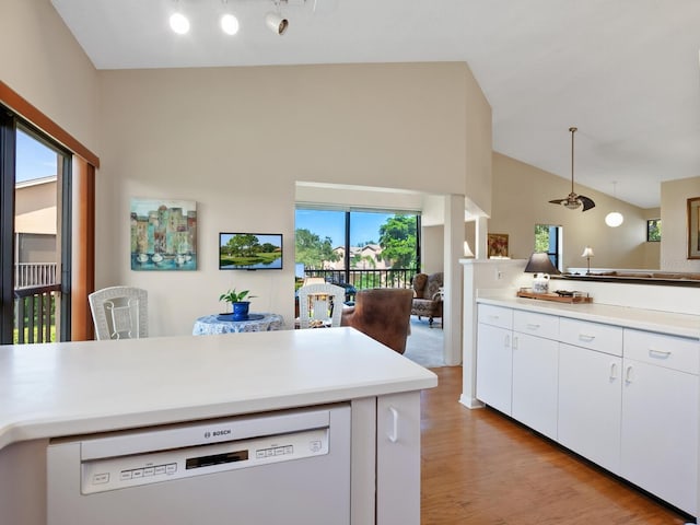 kitchen with dishwasher, white cabinets, light wood-type flooring, and plenty of natural light