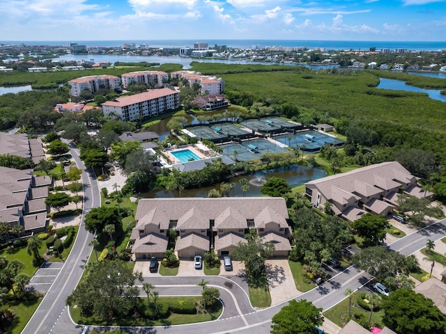 birds eye view of property with a water view