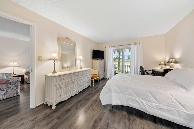 bedroom with dark wood-type flooring and access to exterior