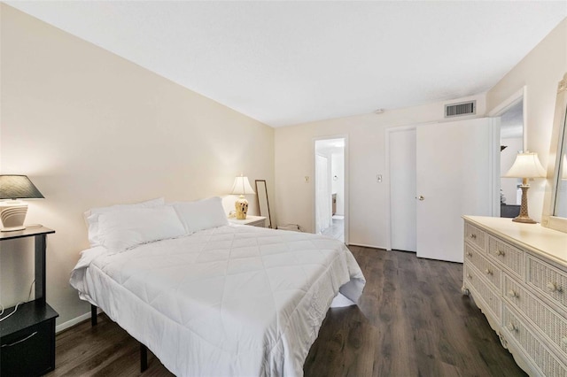 bedroom featuring dark hardwood / wood-style flooring