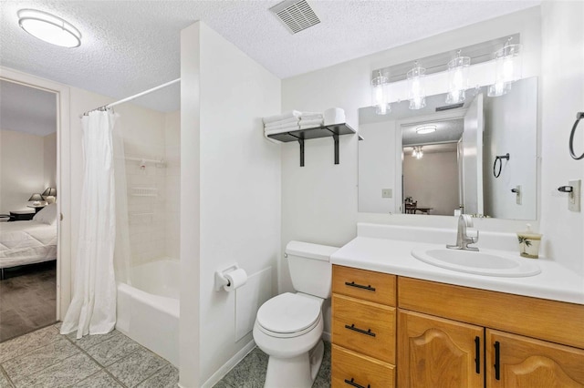 full bathroom with vanity, shower / tub combo, tile patterned floors, a textured ceiling, and toilet