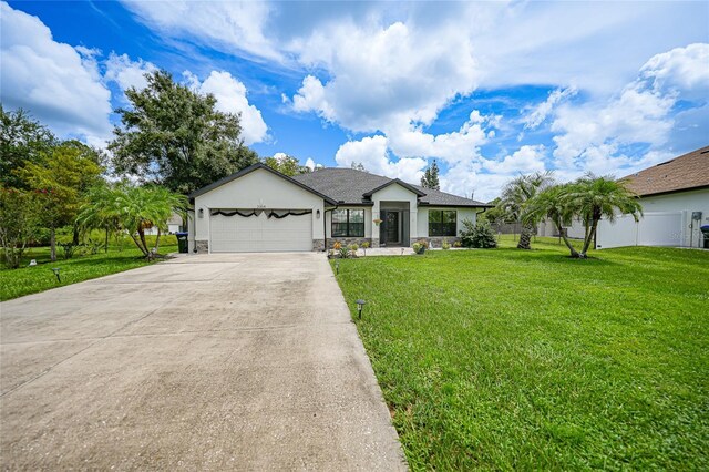 ranch-style home with a garage and a front lawn