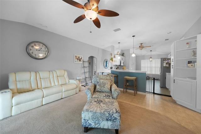 tiled living room featuring vaulted ceiling