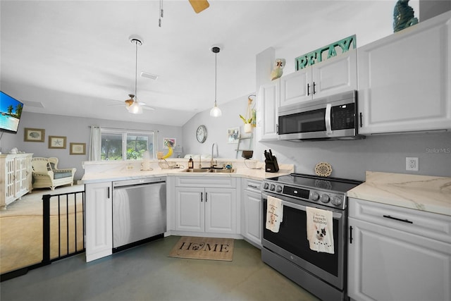 kitchen with sink, ceiling fan, appliances with stainless steel finishes, decorative light fixtures, and white cabinetry