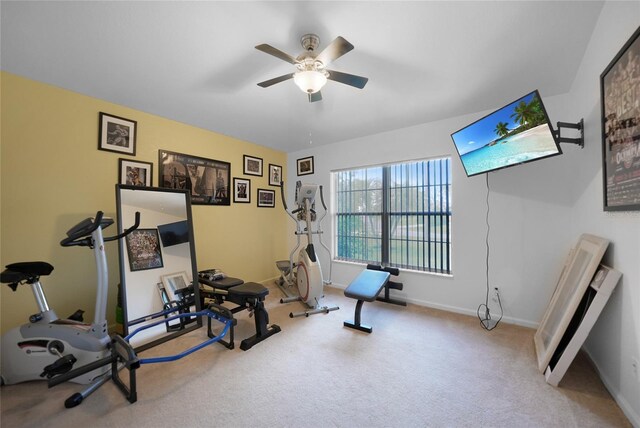 workout area featuring ceiling fan and carpet floors