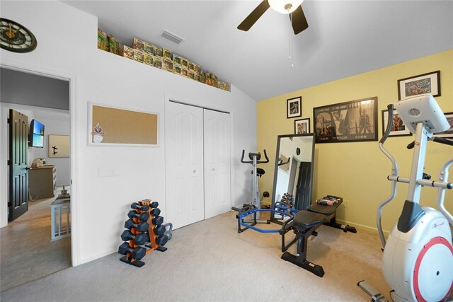 exercise area featuring ceiling fan, carpet floors, and vaulted ceiling