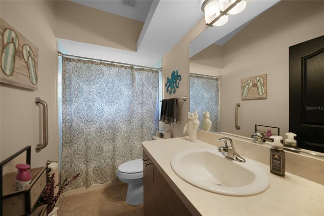 bathroom featuring tile patterned flooring, vanity, toilet, and a shower with shower curtain