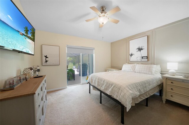 carpeted bedroom with access to outside and ceiling fan