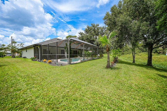 view of yard featuring glass enclosure