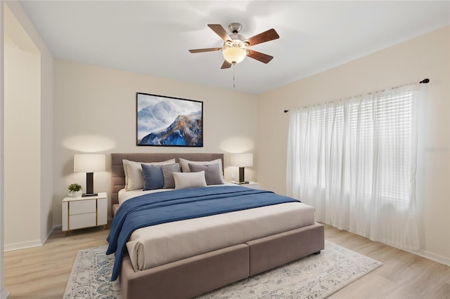 bedroom featuring light hardwood / wood-style floors and ceiling fan