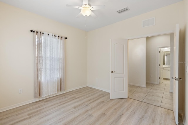 unfurnished bedroom featuring light hardwood / wood-style floors and ceiling fan