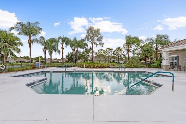 view of swimming pool with a patio