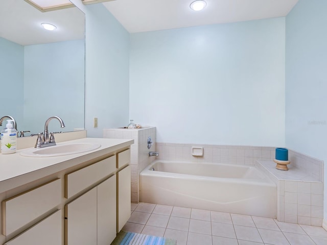 bathroom with vanity, a tub, and tile patterned flooring