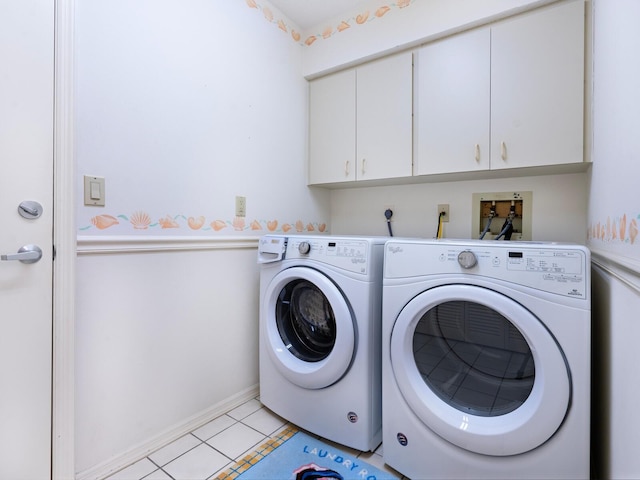 laundry area with independent washer and dryer, cabinets, and light tile patterned flooring