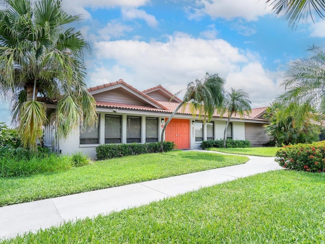 view of front of home with a front lawn