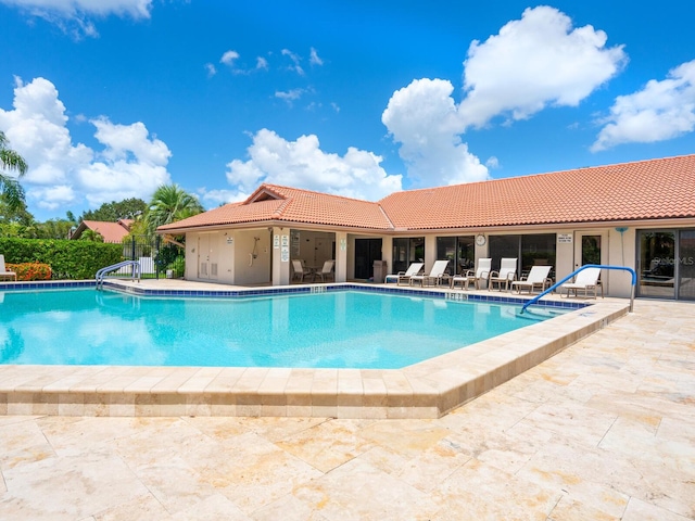 view of swimming pool featuring a patio area