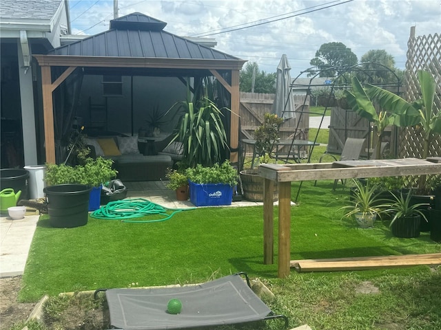 view of yard with a gazebo and fence