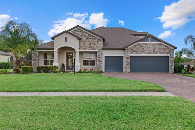 view of front of house featuring a garage and a front yard