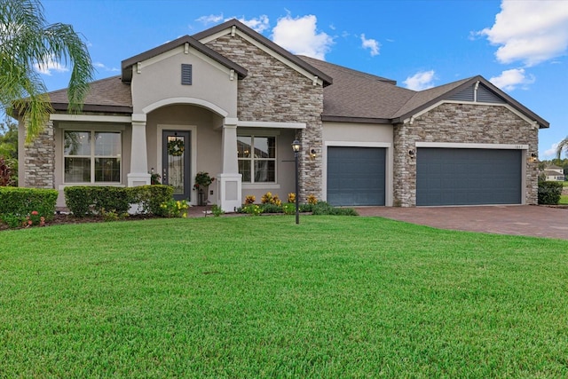 view of front of home featuring a garage and a front yard