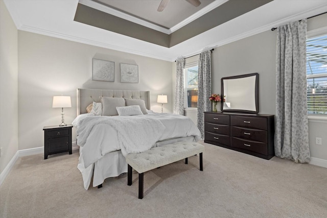 bedroom featuring ceiling fan, crown molding, and light colored carpet