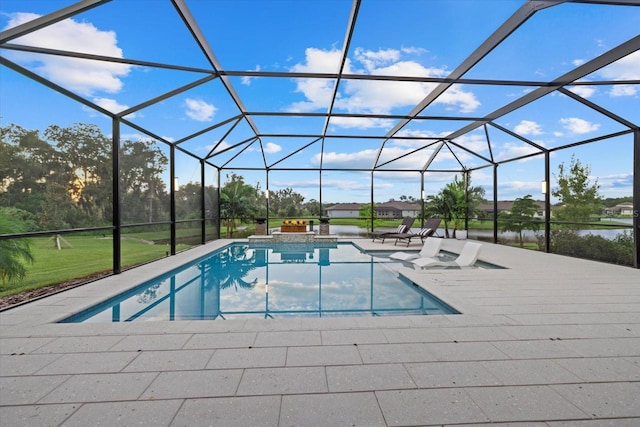 view of pool with a lanai and a patio