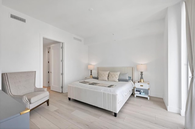 bedroom with light wood-type flooring