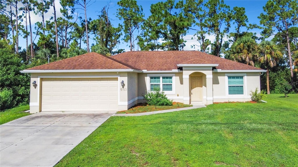 view of front facade featuring driveway, a garage, a shingled roof, a front lawn, and stucco siding