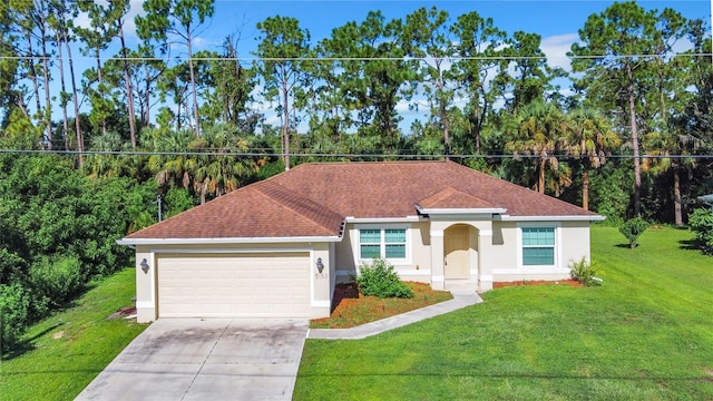 view of front of property with a front lawn and a garage