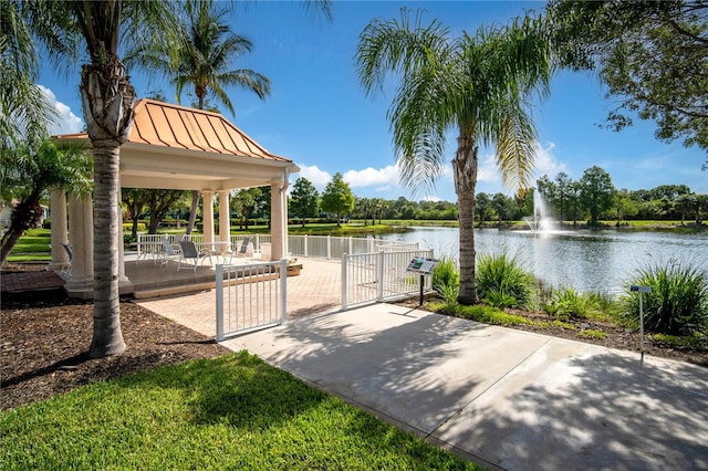 view of patio featuring a water view and a gazebo