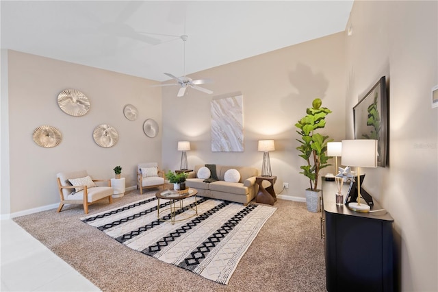 carpeted living room with ceiling fan and lofted ceiling