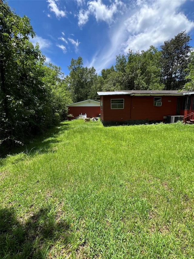 view of yard with central AC