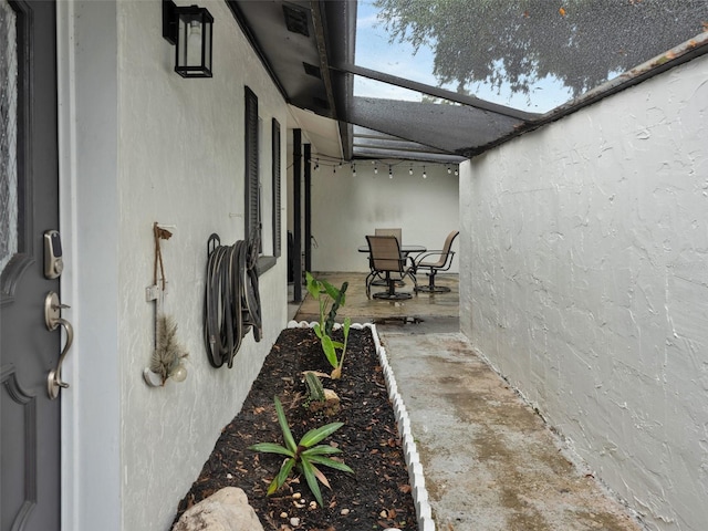 view of side of property featuring a patio